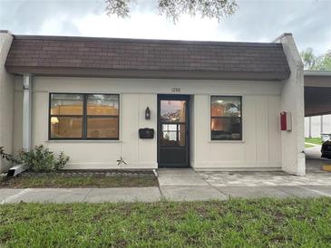 Charming single story home with simple landscaping and designated parking at 1286 Mission Hills Blvd, Clearwater, FL 33759