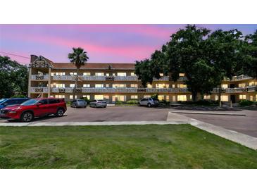 Beautiful condominium building with well-kept grounds, ample parking, and a charming architectural style at 2310 Denmark St # 34, Clearwater, FL 33763