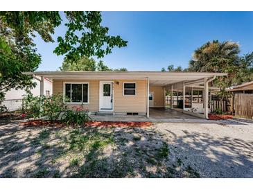 Charming single-story home with a covered carport and well-maintained front yard at 8184 49Th N Ave, St Petersburg, FL 33709