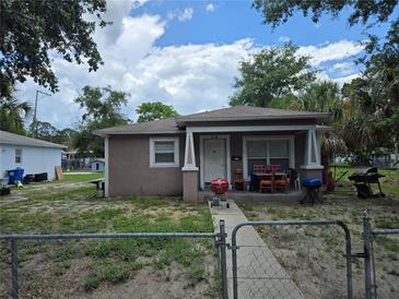 Charming single-story home with a cozy front porch, inviting outdoor gatherings and relaxation at 1000 13Th S Ave, St Petersburg, FL 33705