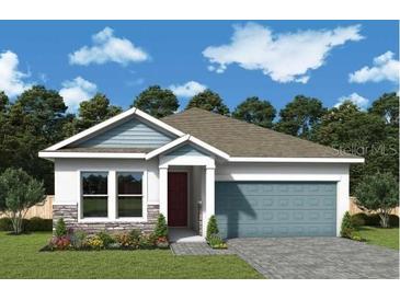 Charming single-story home with a two-car garage, stone accents, and well-manicured landscaping at 10648 Crescent Creek Xing, Parrish, FL 34219