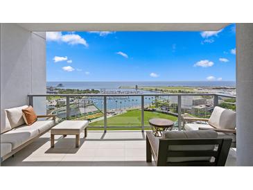 Spacious condo balcony offers seating and expansive views of the water and cityscape at 301 1St S St # 1601, St Petersburg, FL 33701