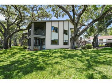 A spacious condominium with mature trees and a well-maintained lawn at 506 Duxbury Ct # A, Safety Harbor, FL 34695