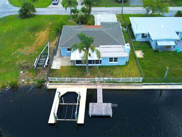 Waterfront home with dock and boat lift access to canal and Gulf of Mexico at 13931 King Ave, Hudson, FL 34667