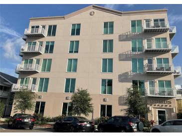 Exterior of building featuring multiple balconies and lush landscaping at 644 3Rd S Ave # 402, St Petersburg, FL 33701