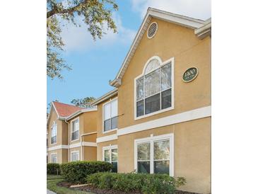 Inviting condo building featuring classic architecture and serene landscaping at 9481 Highland Oak Dr # 1101, Tampa, FL 33647