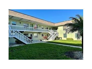 Inviting condo complex featuring well-maintained lawns and traditional architecture at 1250 S Pinellas Ave # 1013, Tarpon Springs, FL 34689