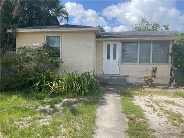 A single Gathering home with a white front door and small front yard at 3110 58Th N Ave, St Petersburg, FL 33714