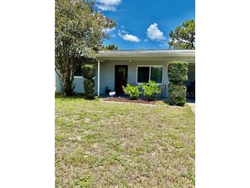 Charming single-story home with well-manicured greenery and a cozy front entrance at 5215 76Th N N St, St Petersburg, FL 33709