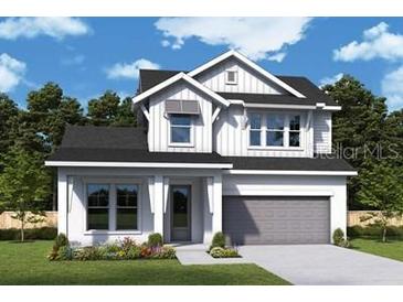 Charming two-story home with a gray two-car garage, white siding, black roof, and well-manicured front yard at 1559 Running Tide Pl, Sarasota, FL 34240