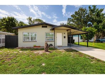Charming single-story home with a carport and well-maintained lawn at 5519 Kelly N Dr, St Petersburg, FL 33703