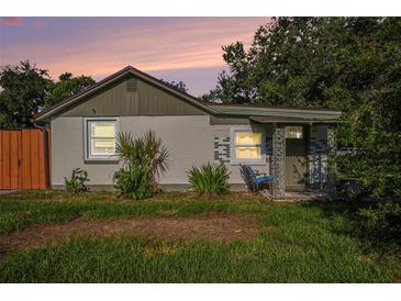 Quaint single-story home with neutral paint, updated windows, and a charming front porch at 5651 6Th St, Zephyrhills, FL 33542