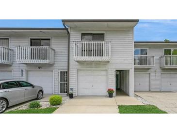 Charming two-story townhome features a private balcony, attached garage, and well-manicured lawn at 6263 93Rd N Ter # 4202, Pinellas Park, FL 33782