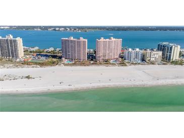 Stunning aerial view of pristine beach and luxurious beachfront highrise condos with gorgeous turquoise water views at 1340 Gulf Blvd # 16F, Clearwater, FL 33767