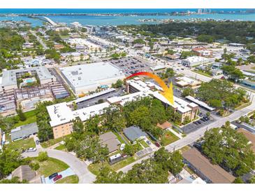 An aerial view of the condo building and surrounding area, close to the water and amenities at 2525 W Bay Dr # A46, Largo, FL 33770