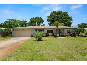 Charming single-story home featuring a manicured lawn and a classic attached one car garage at 791 66Th S Ave, St Petersburg, FL 33705