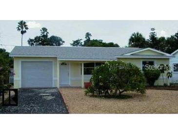 Charming single-story home featuring an attached garage and well-maintained landscaping in a tranquil neighborhood at 2807 Miriam S St, Gulfport, FL 33711