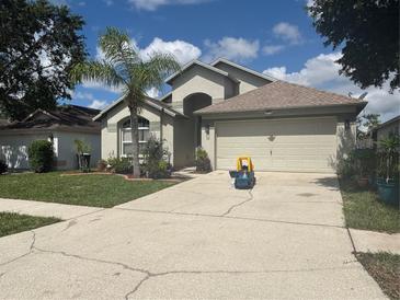 Charming single-story home with well-maintained landscaping, neutral exterior, and attached two-car garage at 4436 Horseshoe Pick Ln, Valrico, FL 33594