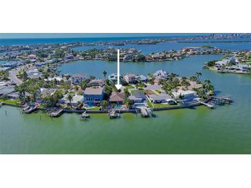 Waterfront home featuring a private dock and a swimming pool at 487 Harbor S Dr, Indian Rocks Beach, FL 33785