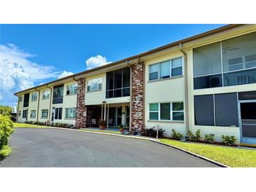 The exterior of this charming condo features a well-maintained facade and lush landscaping at 416 73Rd N Ave # 206, St Petersburg, FL 33702