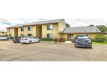 Inviting two-story condo with a well-maintained exterior and ample parking spaces for residents and visitors at 4215 E Bay Dr # 1706A, Clearwater, FL 33764