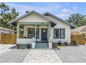 Charming home featuring updated landscaping, new walkway and relaxing front porch with swing at 650 63Rd S Ave, St Petersburg, FL 33705