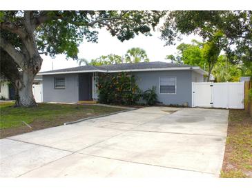Charming single-story home featuring a spacious driveway and well-maintained landscaping at 1317 S Betty Ln, Clearwater, FL 33756