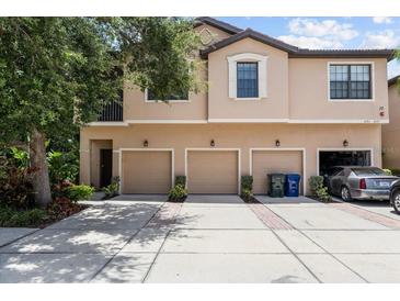 Charming townhome with three garage doors and a well-maintained concrete driveway at 4103 Via Piedra Cir # 10-101, Sarasota, FL 34233