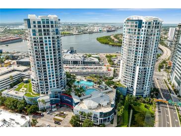 Stunning aerial view of the Towers condominium complex featuring a pool, manicured landscaping, and waterfront views at 449 S 12Th St # 1004, Tampa, FL 33602