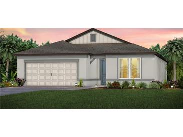 Charming single-story home features a neutral color palette, attached garage, and well-maintained landscaping at 11444 Shoreline Trl, Parrish, FL 34219