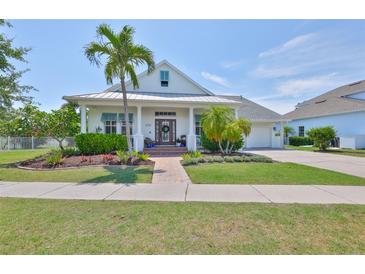Charming single-Gathering home with a beautifully landscaped front yard and inviting curb appeal at 5710 Tortoise Pl, Apollo Beach, FL 33572