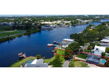 Aerial view of waterfront property with canal access and space for a dock at 2205 N Riverside Dr, Tampa, FL 33602