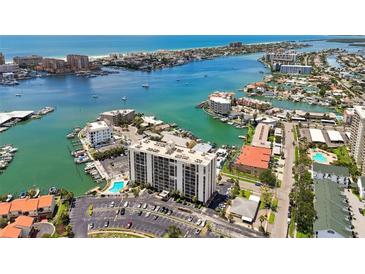 Beautiful waterfront condo complex with pool, boat docks, and stunning coastal views at 255 Dolphin Pt # 207, Clearwater Beach, FL 33767