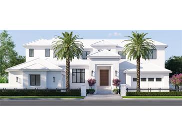 Stunning two-story white home featuring a symmetrical facade, brick accents, palm trees, and a manicured lawn at 38 Ladoga Ave, Tampa, FL 33606