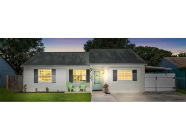Charming single-story home with a well-maintained lawn, neutral paint, and decorative shutters at 3133 Payne St, New Port Richey, FL 34655
