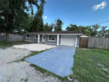 Charming single-story home with well-maintained landscaping and a spacious driveway at 12009 Washington St, Seffner, FL 33584