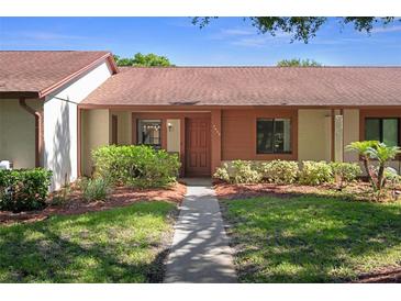 Charming single-story home featuring a landscaped yard and inviting front entrance at 7433 Greystone Dr # 7433, Hudson, FL 34667