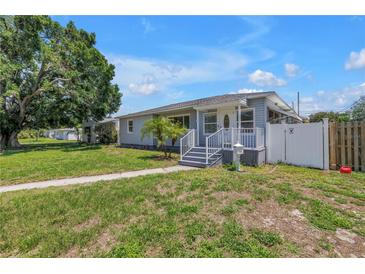 Charming single-story home with a well-manicured lawn and inviting walkway at 774 40Th Ne Ave, St Petersburg, FL 33703
