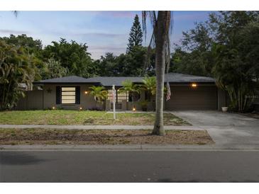 Charming single Gathering home with a well-maintained lawn and cozy curb appeal at 2199 Blue Tern Dr, Palm Harbor, FL 34683