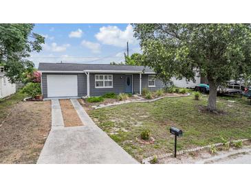 Charming single-story home featuring a well-maintained lawn and inviting curb appeal at 3625 Oakhurst Dr, Holiday, FL 34691