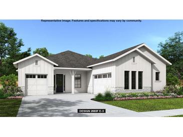 Beautiful one story home featuring white sidings, stone accents, dark roof, manicured lawn and a two car garage at 4612 Southern Valley Loop, Brooksville, FL 34601