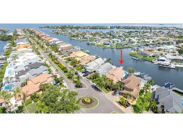 Waterfront home featuring private boat dock, beautiful landscaping and an oversized two-car garage at 835 Symphony Isles Blvd, Apollo Beach, FL 33572