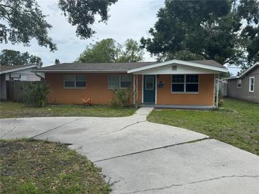 Charming single-story home with a well-maintained lawn and a classic concrete driveway at 217 43Rd Ne Ave, St Petersburg, FL 33703