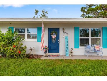 Charming home entrance featuring a patriotic wreath and colorful accents at 3015 Florida Blvd, Bradenton, FL 34207