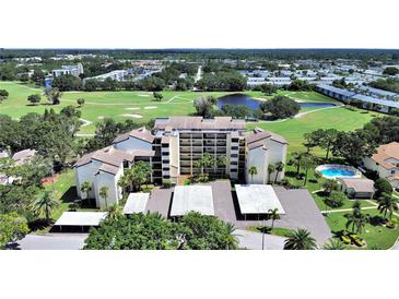 Beautiful aerial view of the condo complex, golf course, lake and the surrounding landscape at 700 Starkey Rd # 311, Largo, FL 33771