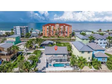 Stunning beach house with a private pool and within walking distance to nearby shops and restaurants at 19111 Whispering Pines Dr, Indian Shores, FL 33785