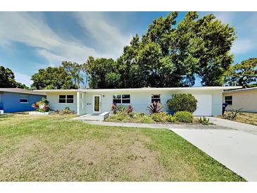 Charming single-story home featuring manicured landscaping and a freshly painted exterior at 4505 S Clark Ave, Tampa, FL 33611