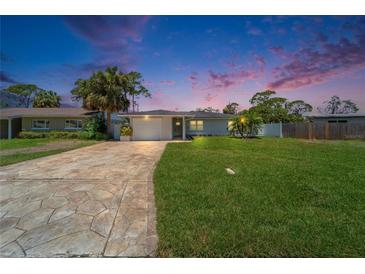 Charming single-story home with a well-manicured lawn and inviting curb appeal at 4518 Helena Ne St, St Petersburg, FL 33703