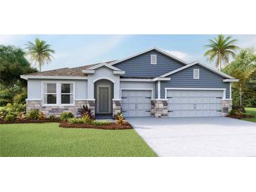 Charming single-Gathering home with a two-car garage and stone accents at 4017 Harvest Hearth Pl, Plant City, FL 33565