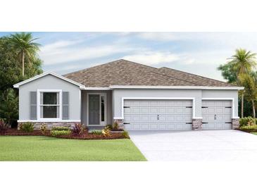 Charming single-story home with a three-car garage and stone accents at 4024 Harvest Hearth Pl, Plant City, FL 33565